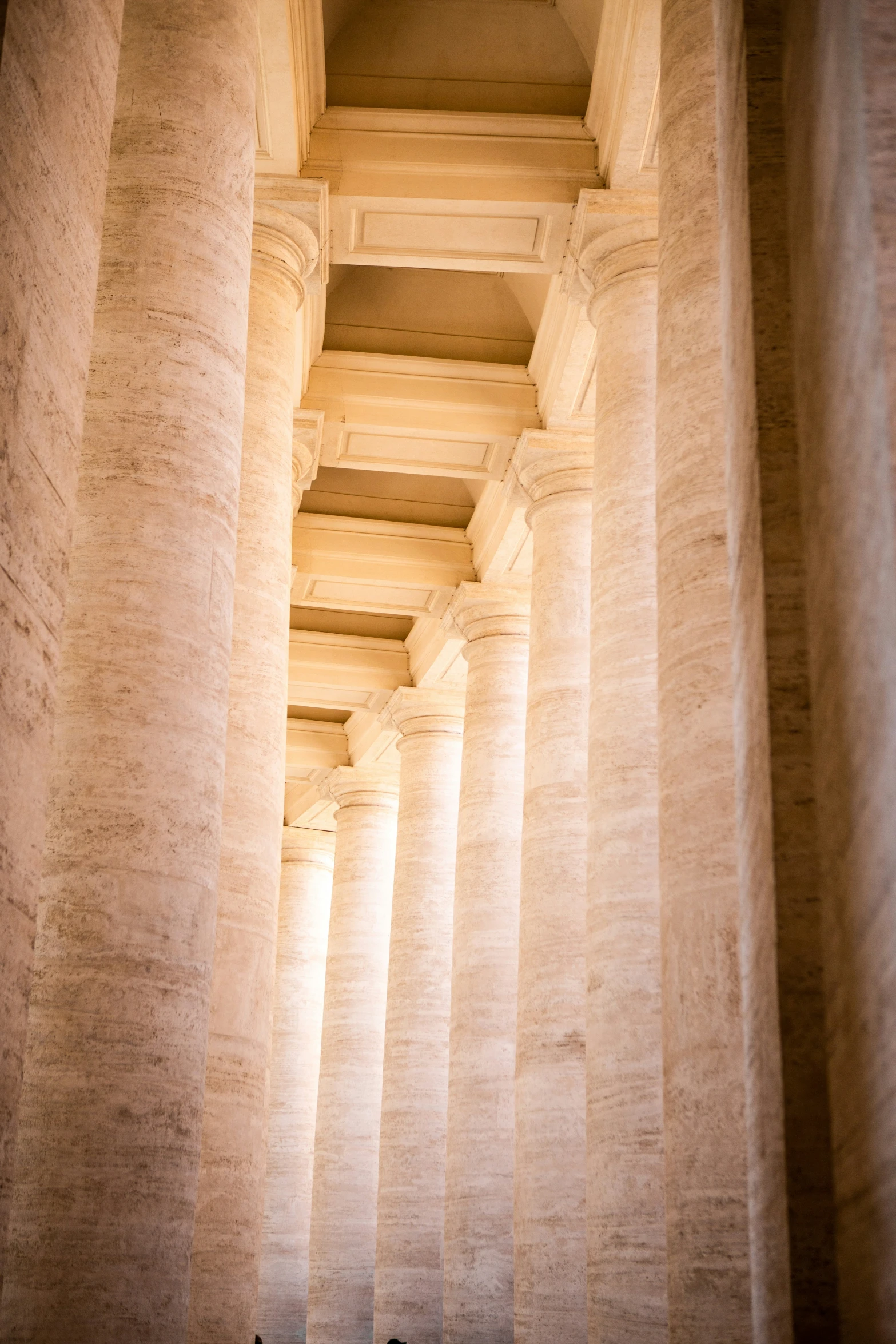 several pillars lined with light in an indoor building