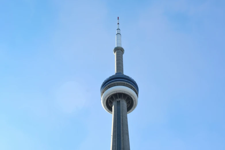 a tall building has a tall spire on top