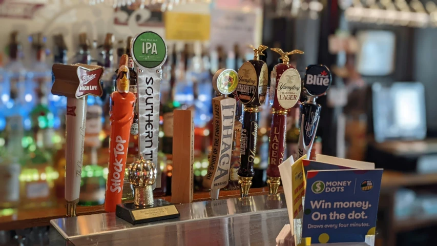 many trophies are lined up at a bar