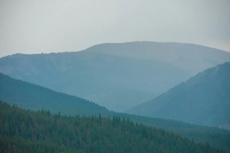 the mountains are covered in a lot of mist