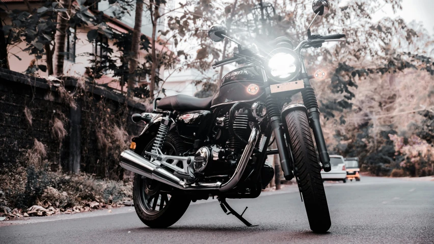 a motorcycle sitting parked in the middle of a road