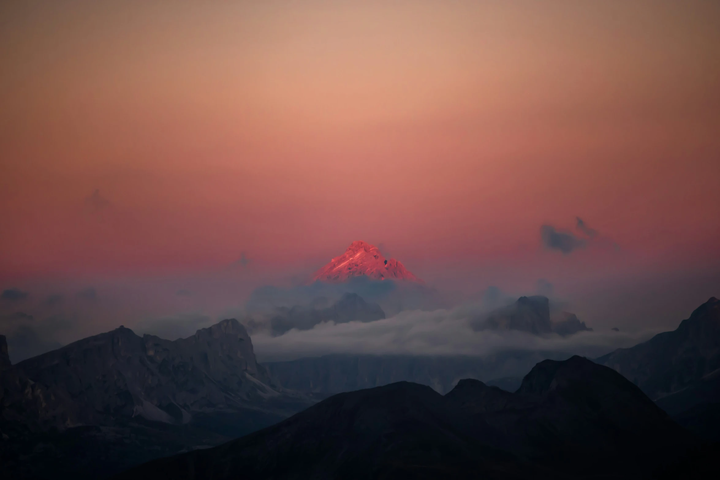 mountain view with pink skies at sunset above