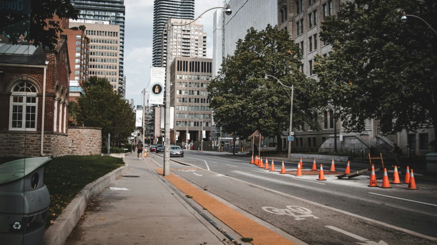 an intersection in an urban setting with a clock tower in the background