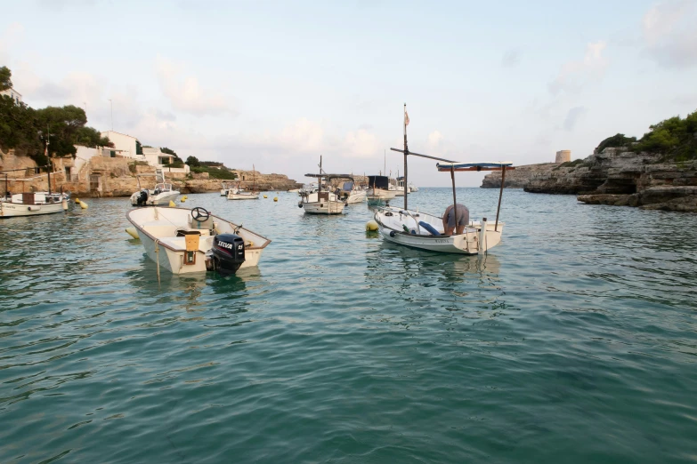 several boats are out on the water in the harbor