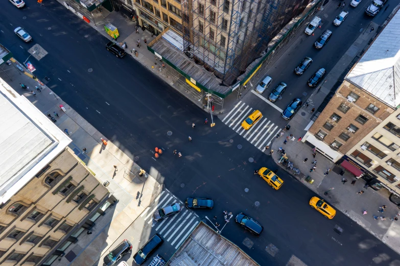 an aerial view of a parking lot with many cars