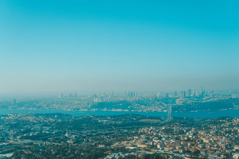 a city on the horizon with a view of water