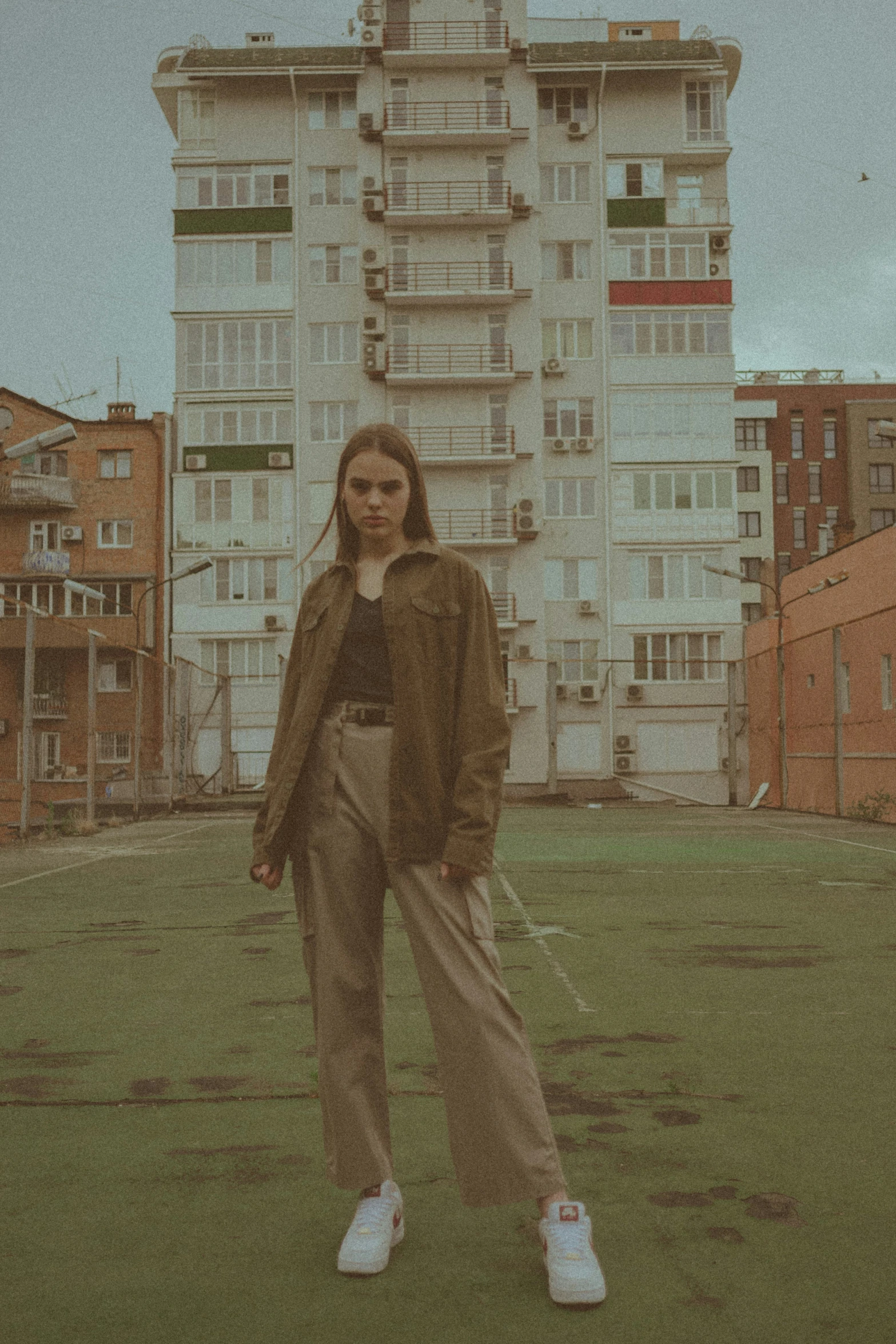 a woman standing in front of a building