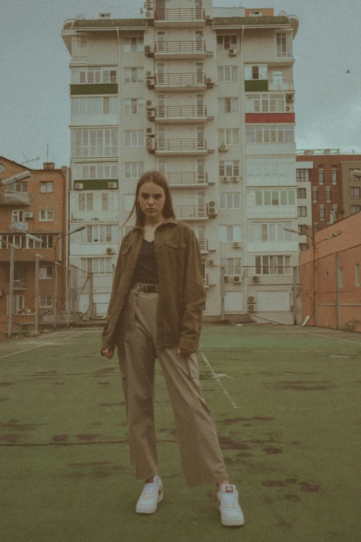 a woman standing in front of a building