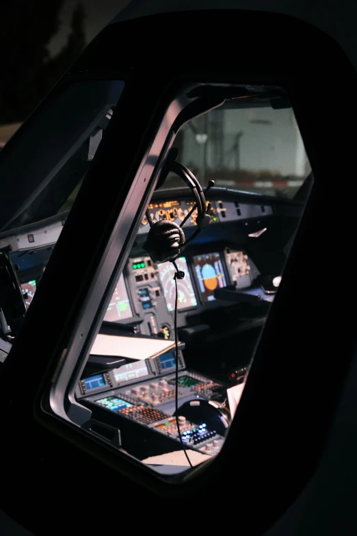 a pilots seat and instrument instruments at night time