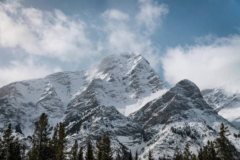 the tops of mountains are covered with snow