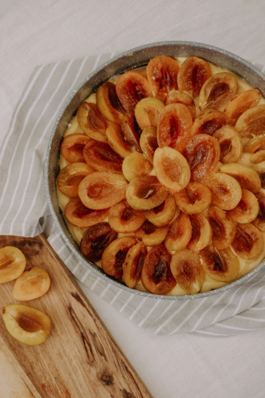 there is a pie in a pan on a table with a spatula