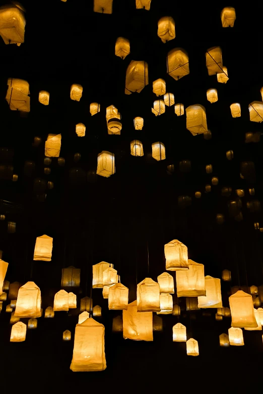 lanterns are glowing over a black background