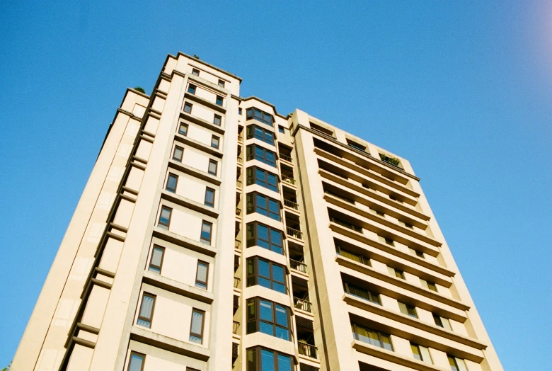 a tall building with a clock tower on it's side