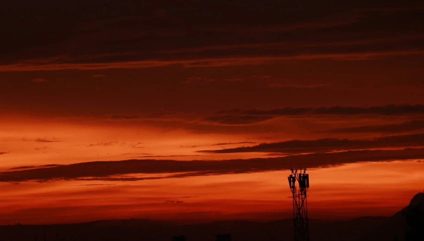 two airplanes are seen in front of the sunset