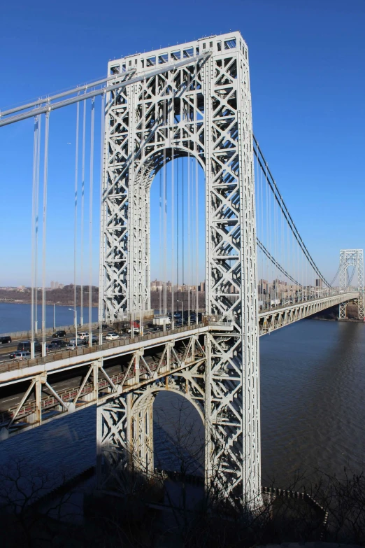 the very tall bridge has many wires