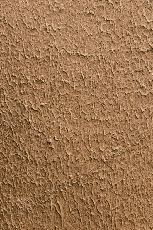 a stucco background with some kind of pattern