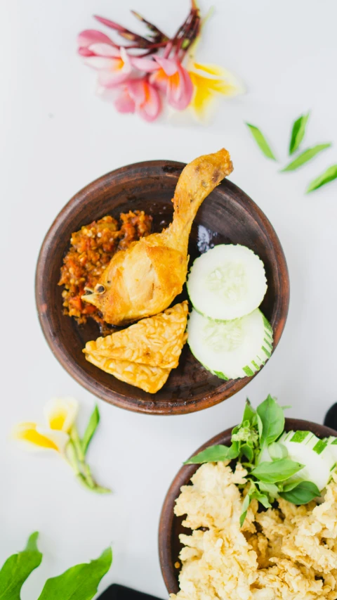 a bowl containing fried food on the table