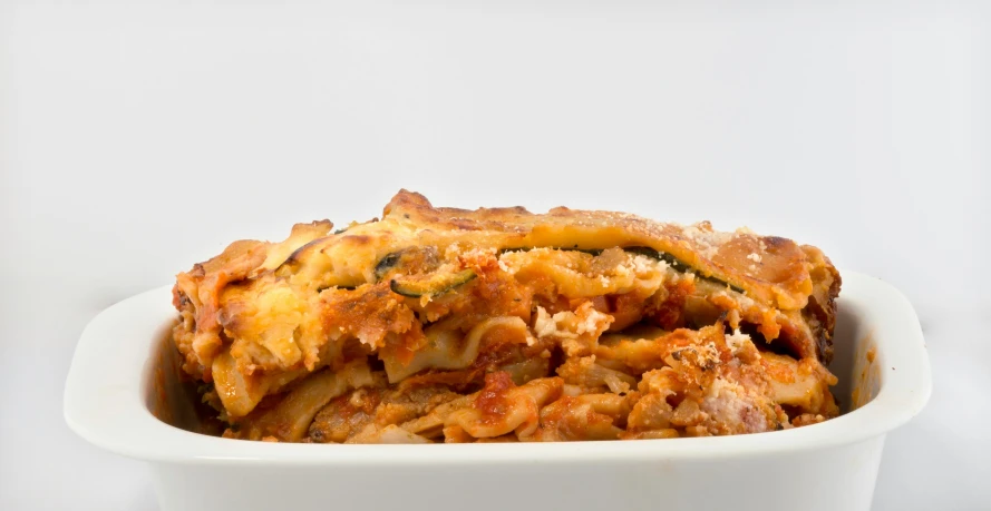 a large bowl of food with meat and vegetables