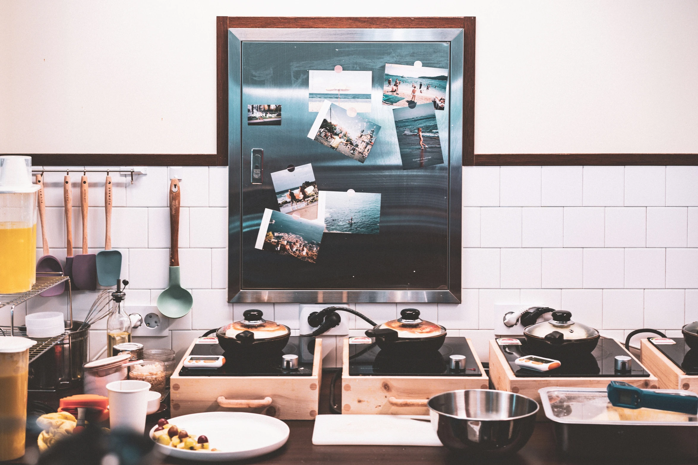 a picture hanging over a stove in a kitchen