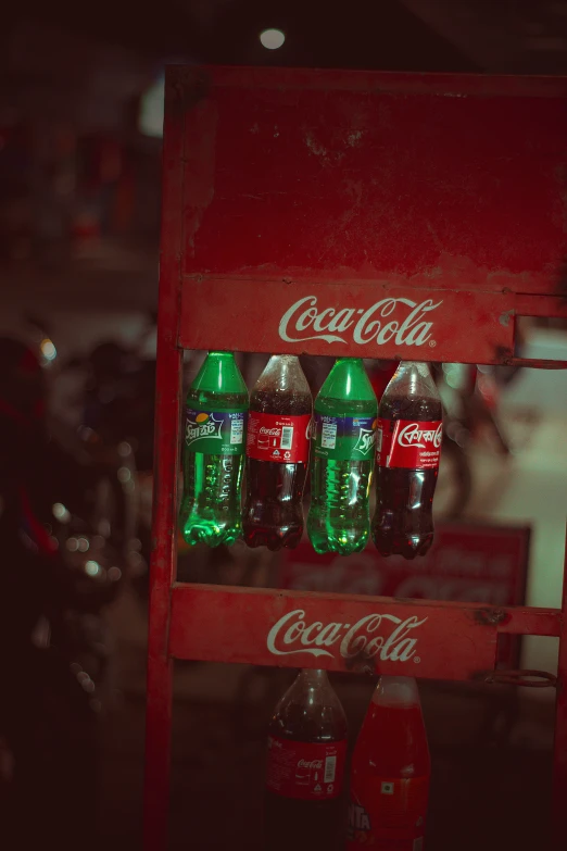 a display with coca colas and a soda bottle in it