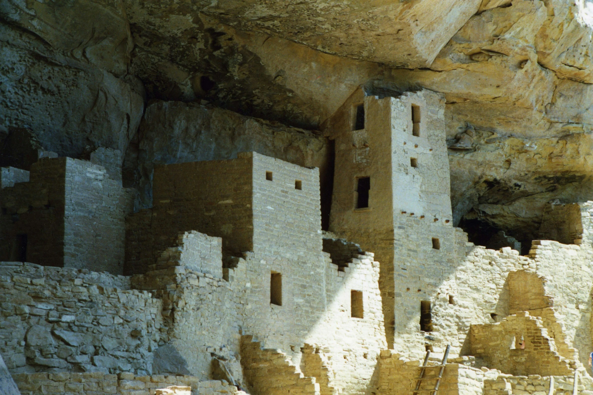 an old abandoned house stands in the cliff