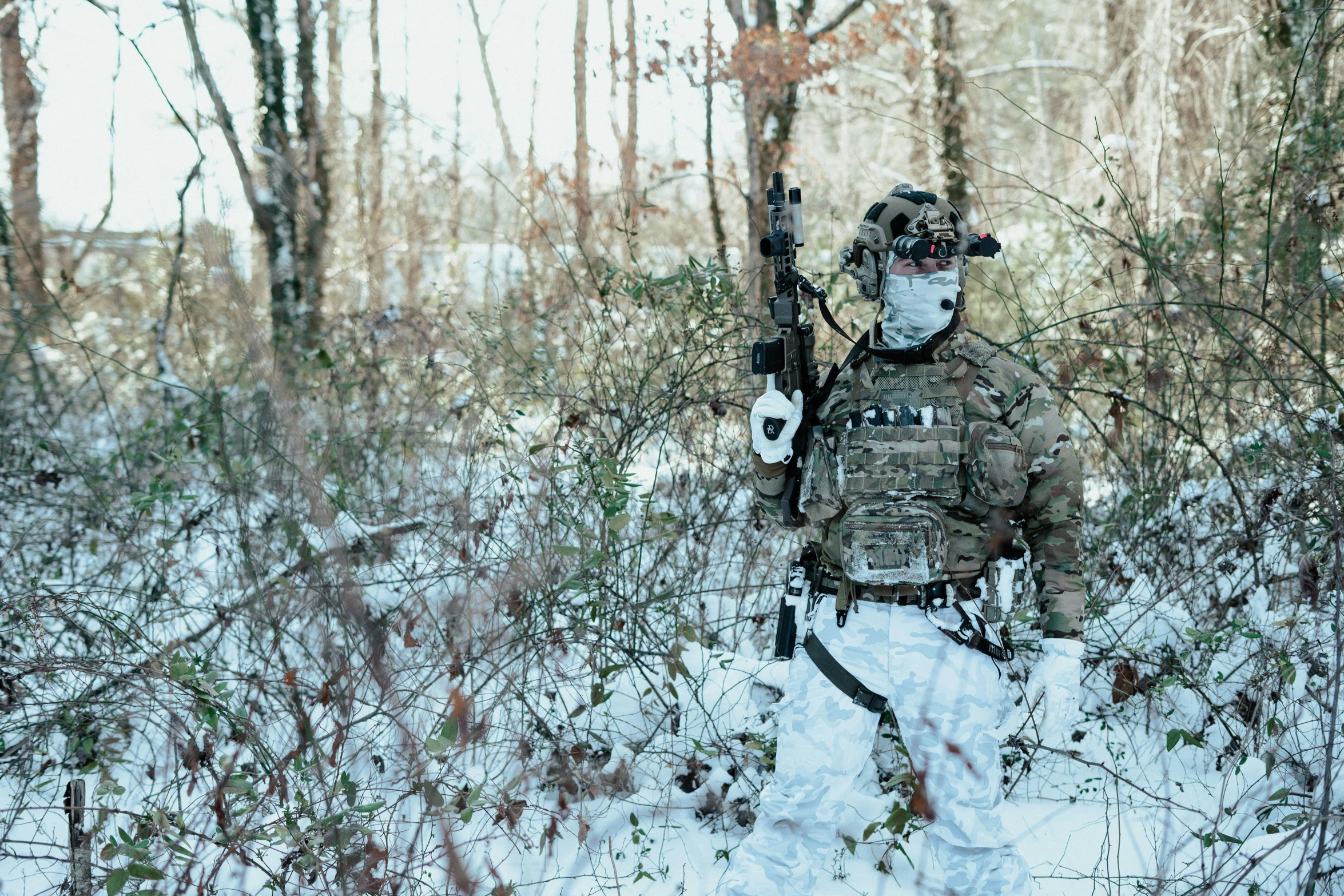 a man with a backpack that is standing in the snow