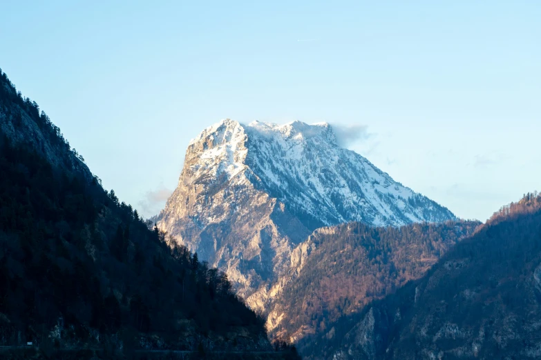 a very tall mountain with a snow covered top