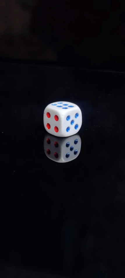 a pair of dices sit on a table