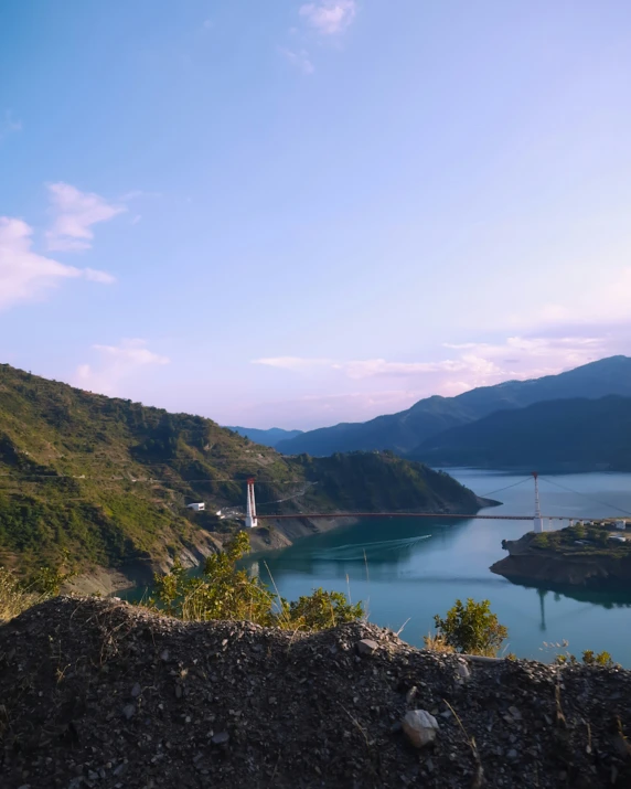 a landscape s of a lake surrounded by hills