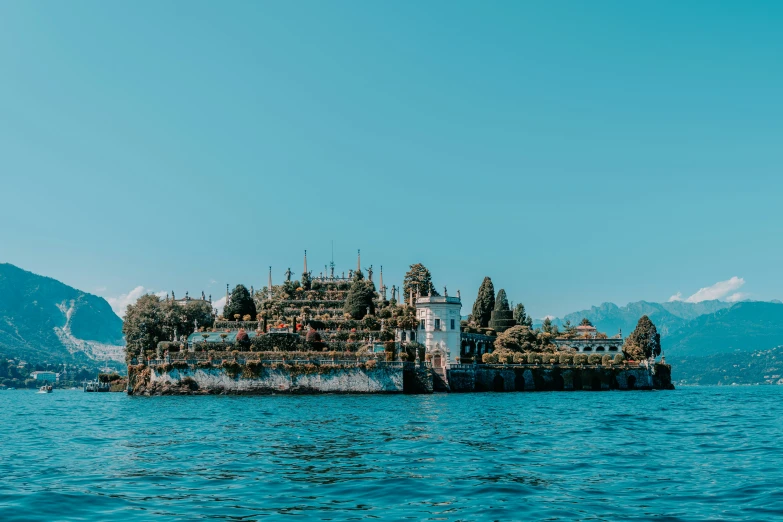 a building built to look like a castle on the shore