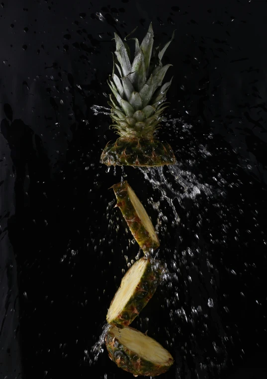 pineapple slices being thrown into the water