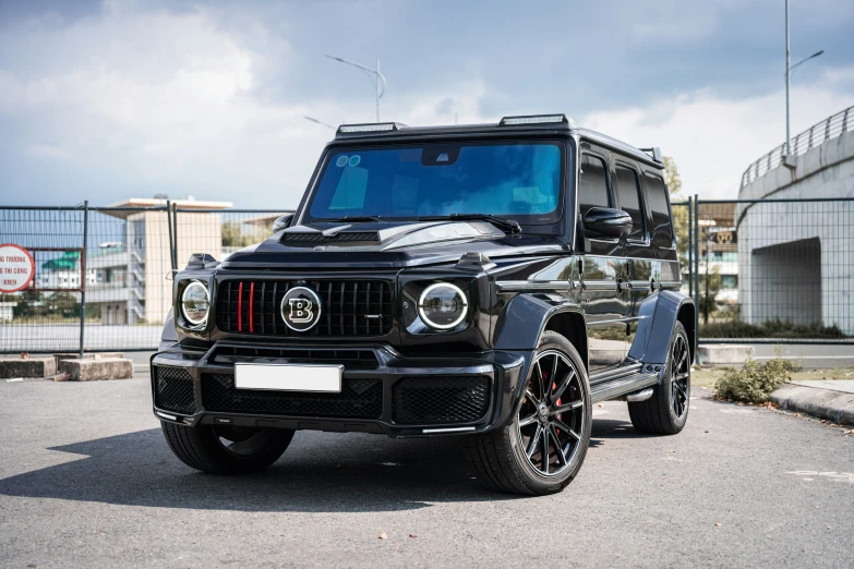 a black jeep is parked on a parking lot