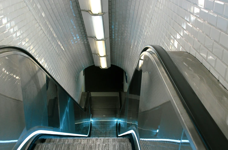 escalator with blue light at the end