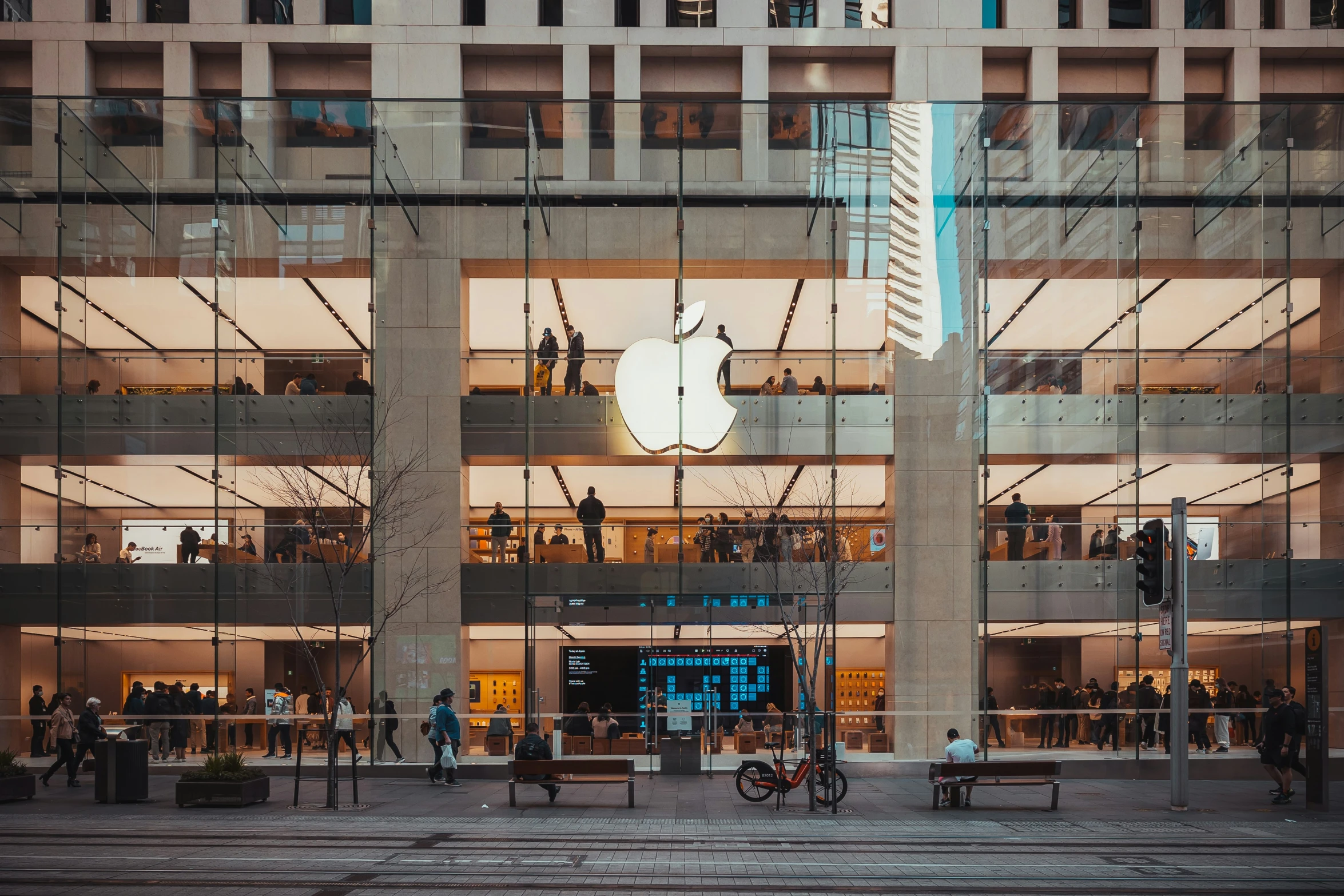 an apple store on the corner of a building in new york city