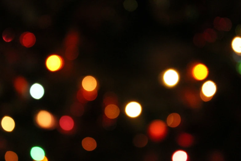 a blurry, colorful background of colored lights