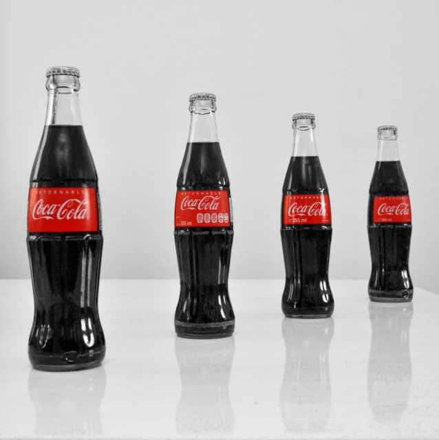 an image of a group of coke bottle bottles