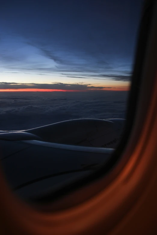a view of the inside of an airplane with a very beautiful sunrise