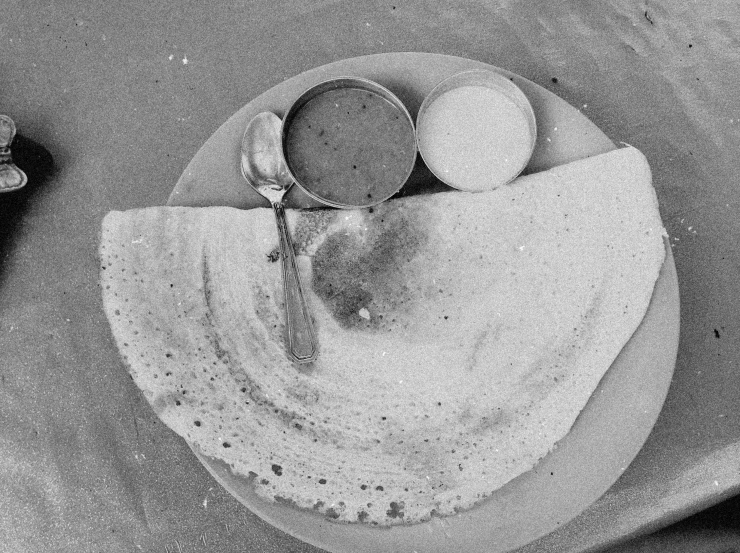 a tortilla topped with three ingredients, one being made