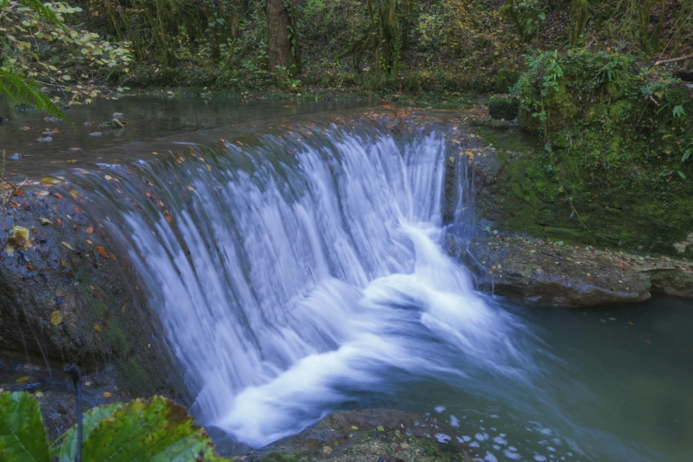 water flowing over the edge of a river