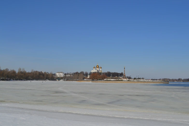 a view of a body of water with a building in the distance