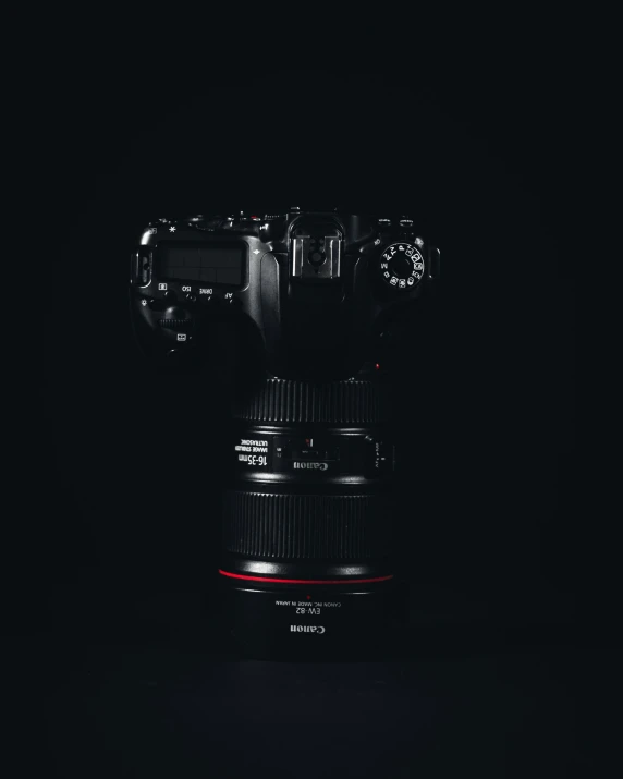 a camera sitting on top of a dark background