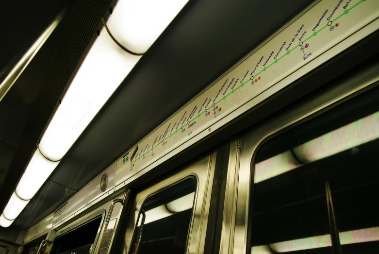 a subway car with a number of lines on it's side