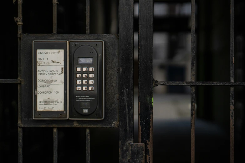 a cell phone sitting on top of a  gate