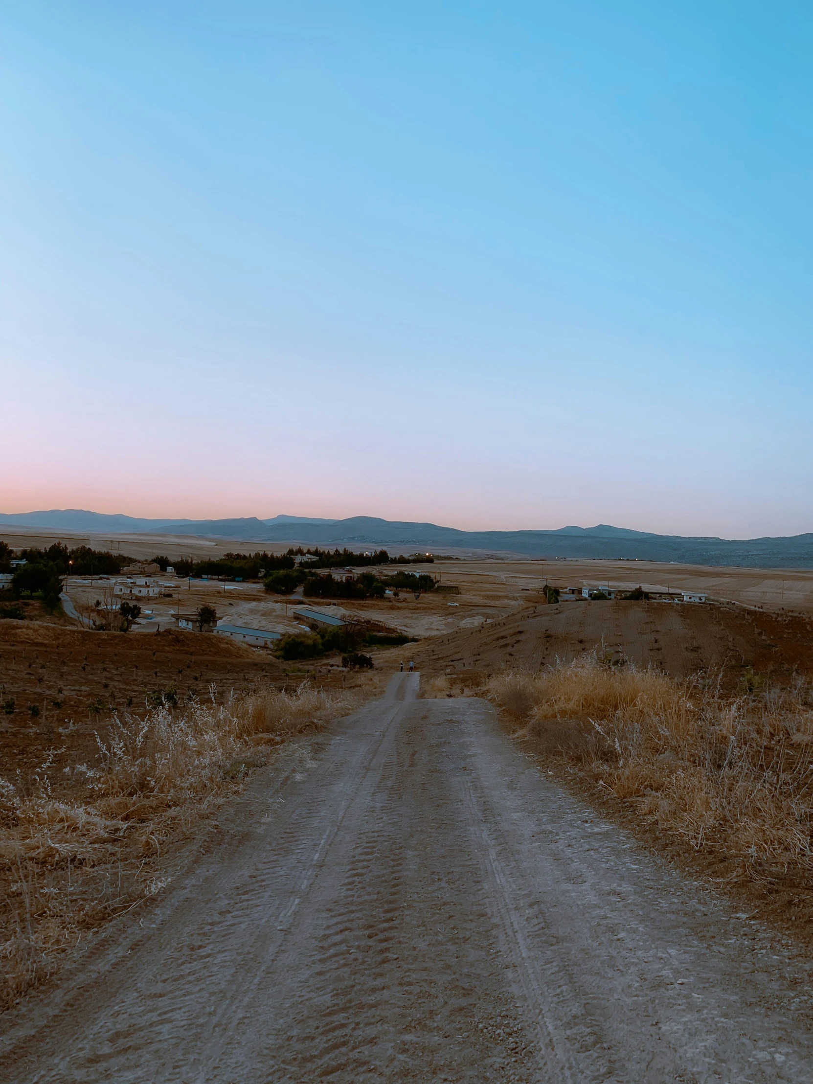 a road in a dry desert with no vehicles on it