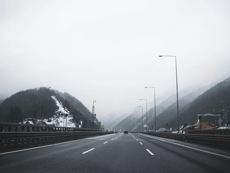 a picture taken from inside of the car, looking at the highway