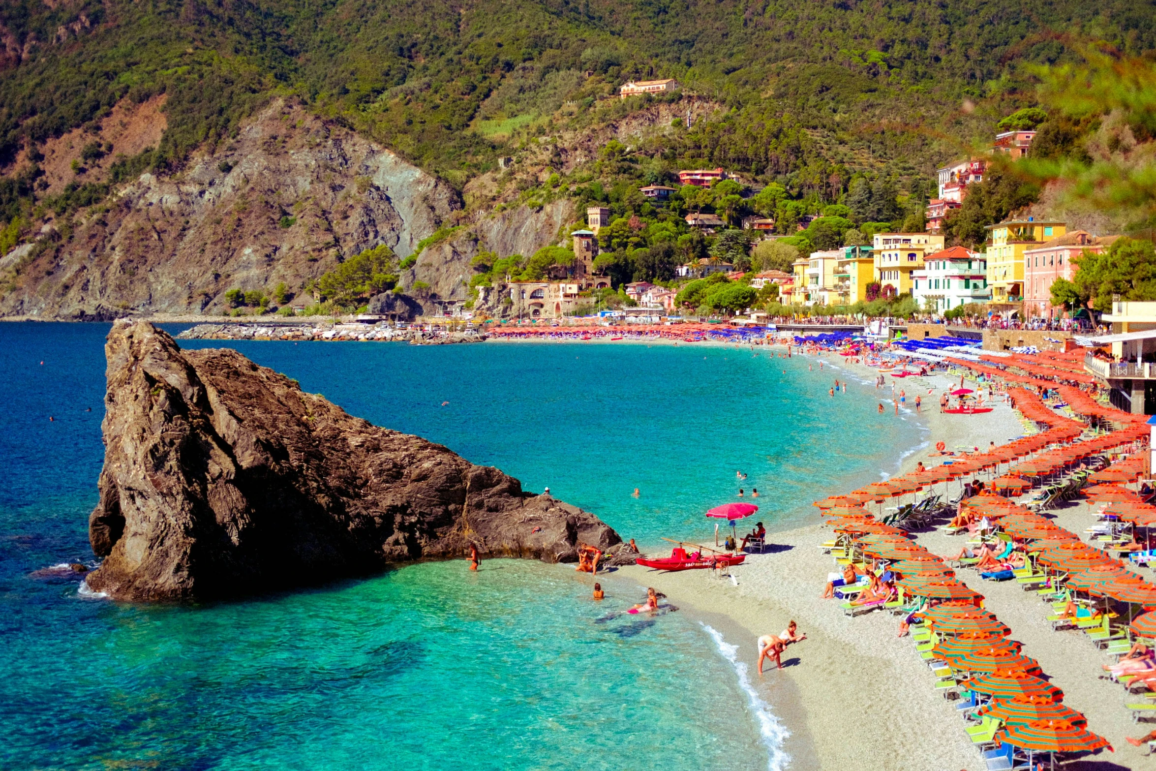 an aerial view of a beautiful, colorful resort beach