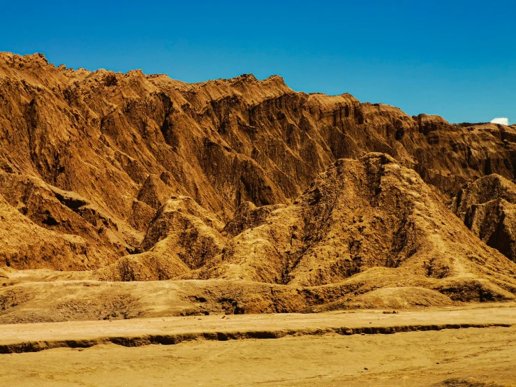 a mountain range that is almost completely covered with sand