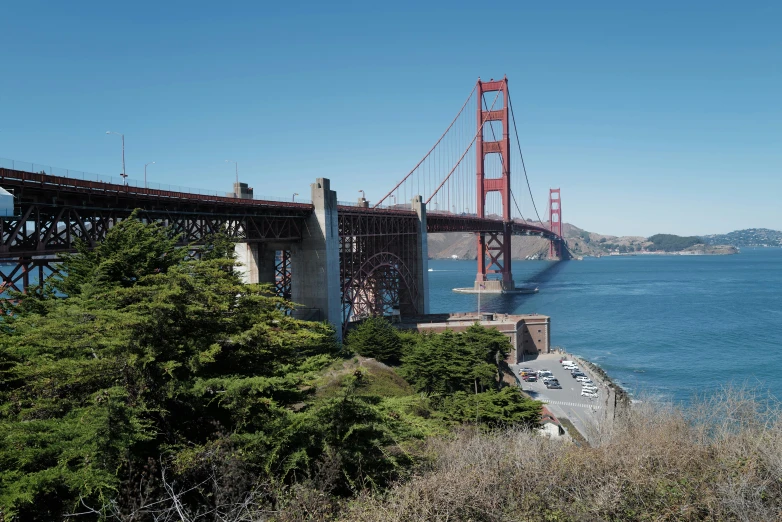 the large bridge looks very large and supports the vehicles