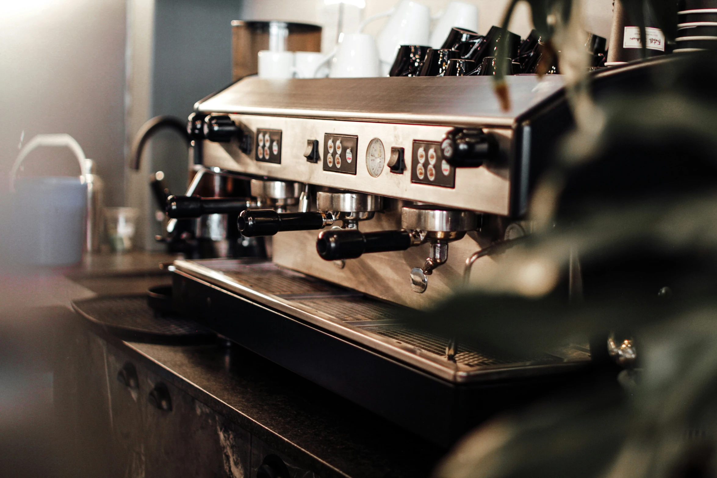 an image of an espresso machine with coffee being poured