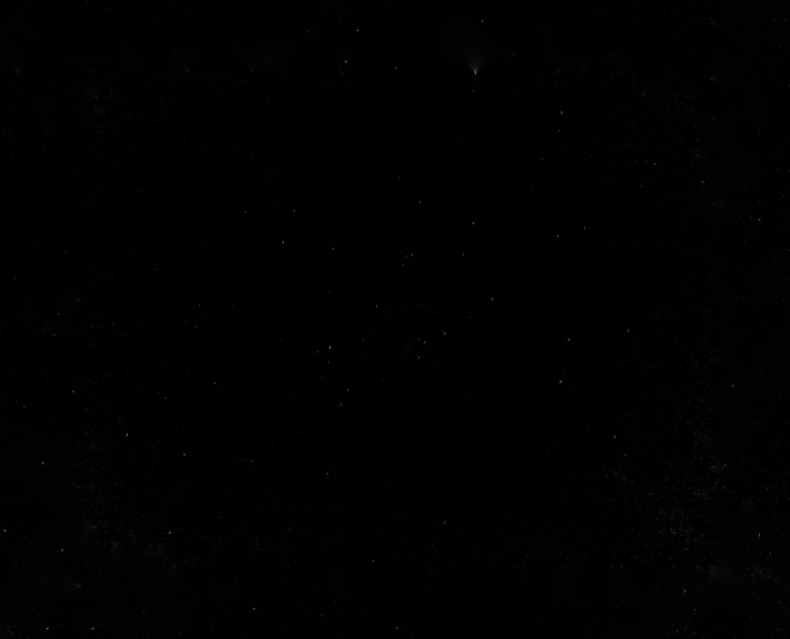 a black space po with stars as the moon is seen in the distance